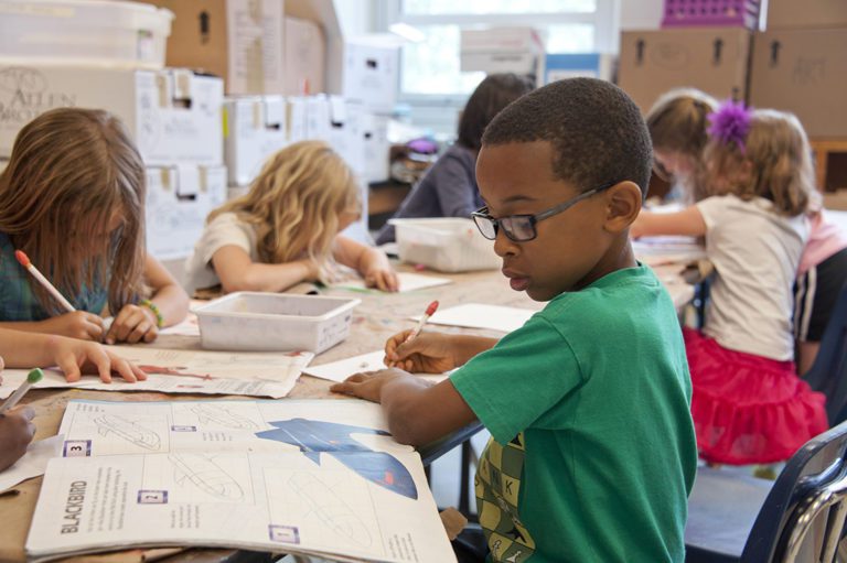 A photo of a kids in the classroom making art