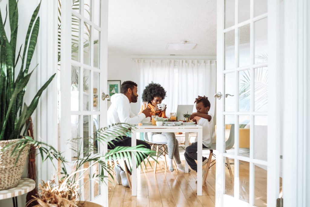 A photo of a family eating breakfast