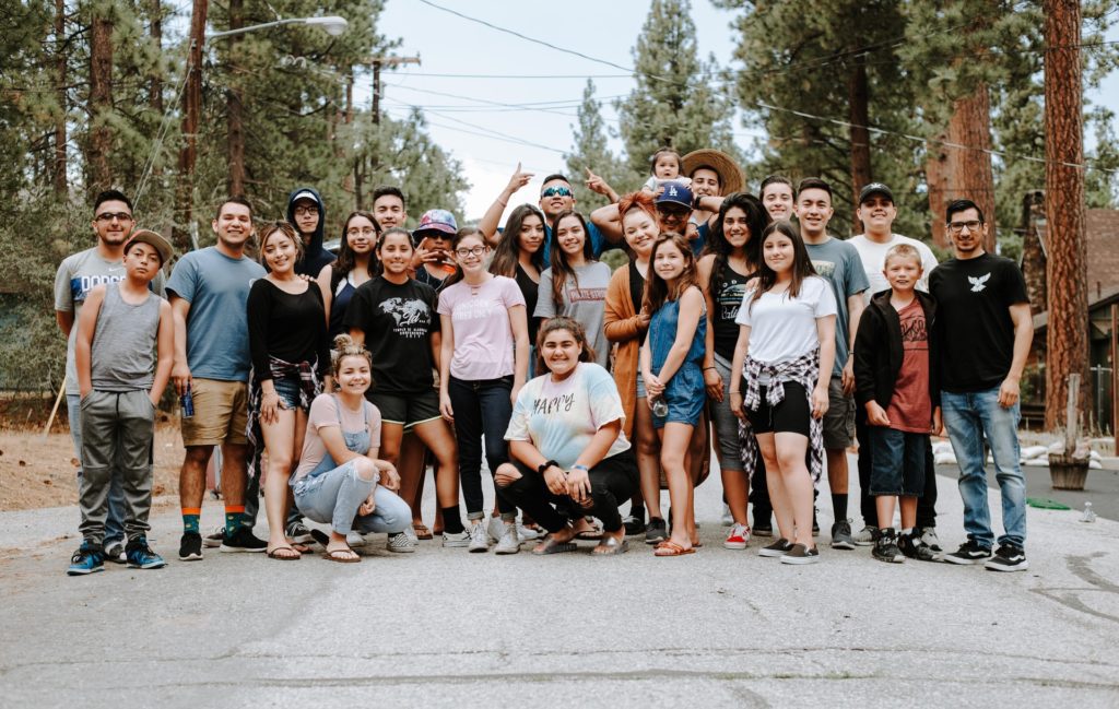 A photo of teenagers in the forest