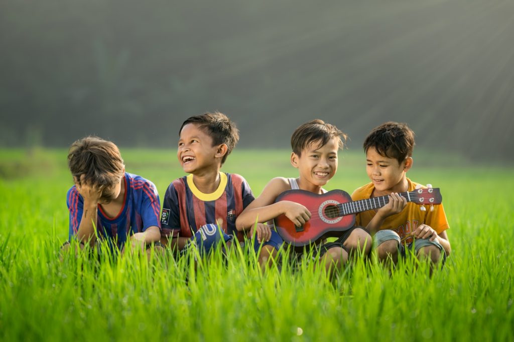 A photo of kids in the grass