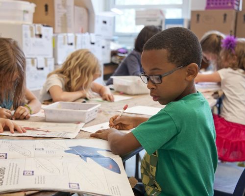 A photo of a kids in the classroom making art