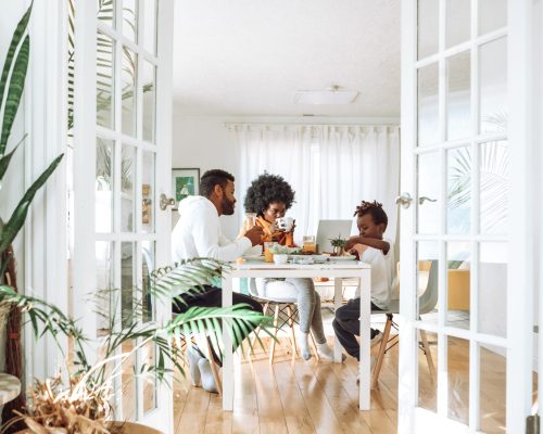 A photo of a family eating breakfast