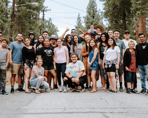 A photo of teenagers in the forest