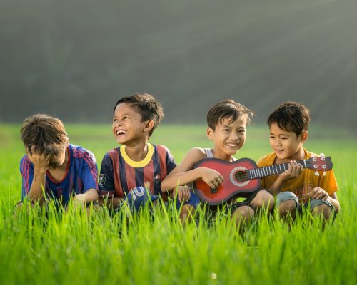 A photo of kids in the grass